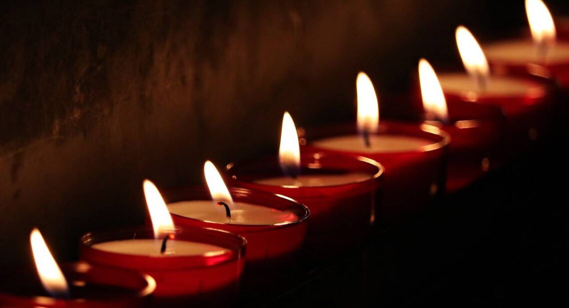 row of tea lights and indian diyas