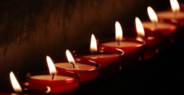 row of tea lights and indian diyas