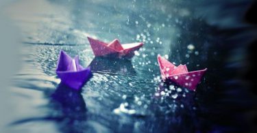 paper boats in rain
