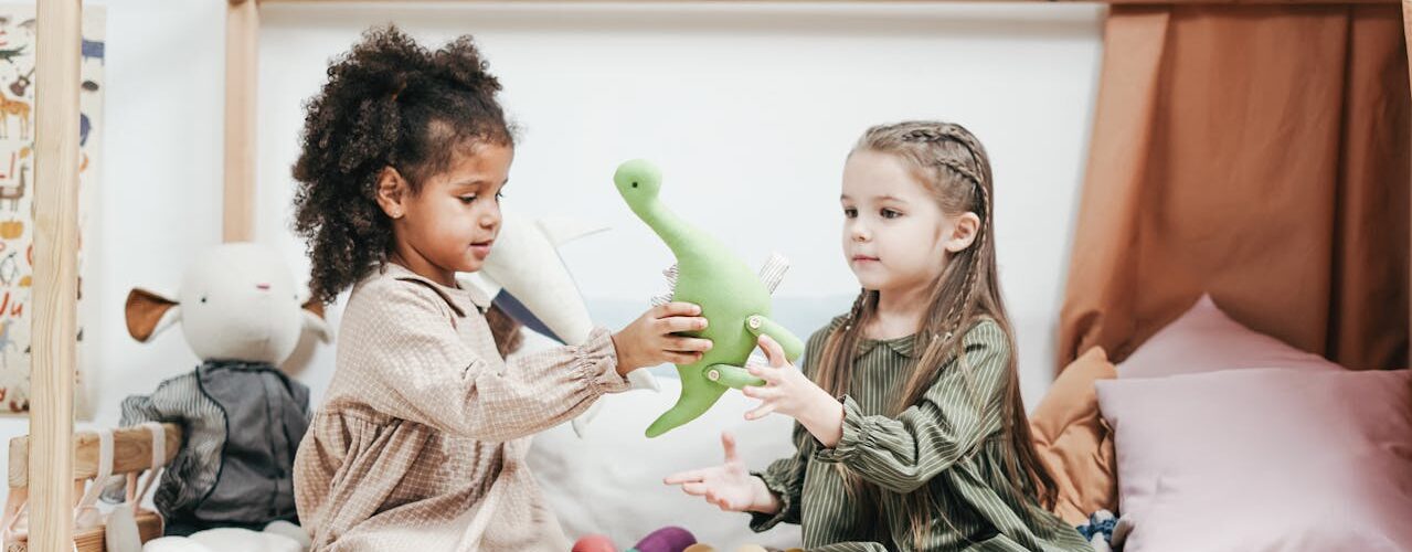 two children playing with toys friendship