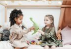 two children playing with toys friendship