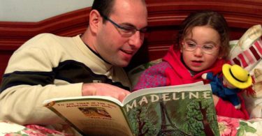 father and daughter reading