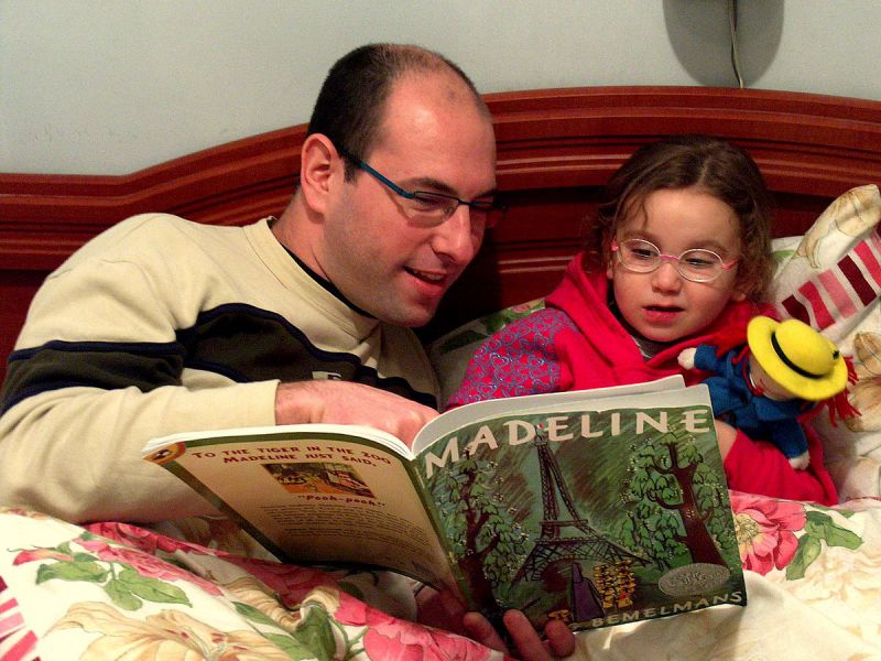 father and daughter reading