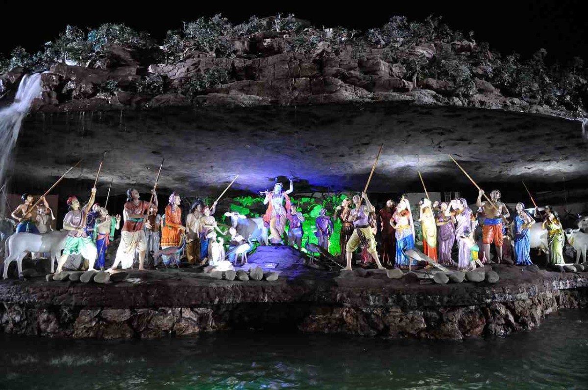 Krishna Holding Govardhan Giri Villagers With Sticks