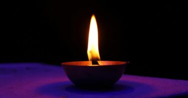Oil lamp made of clay on a wall